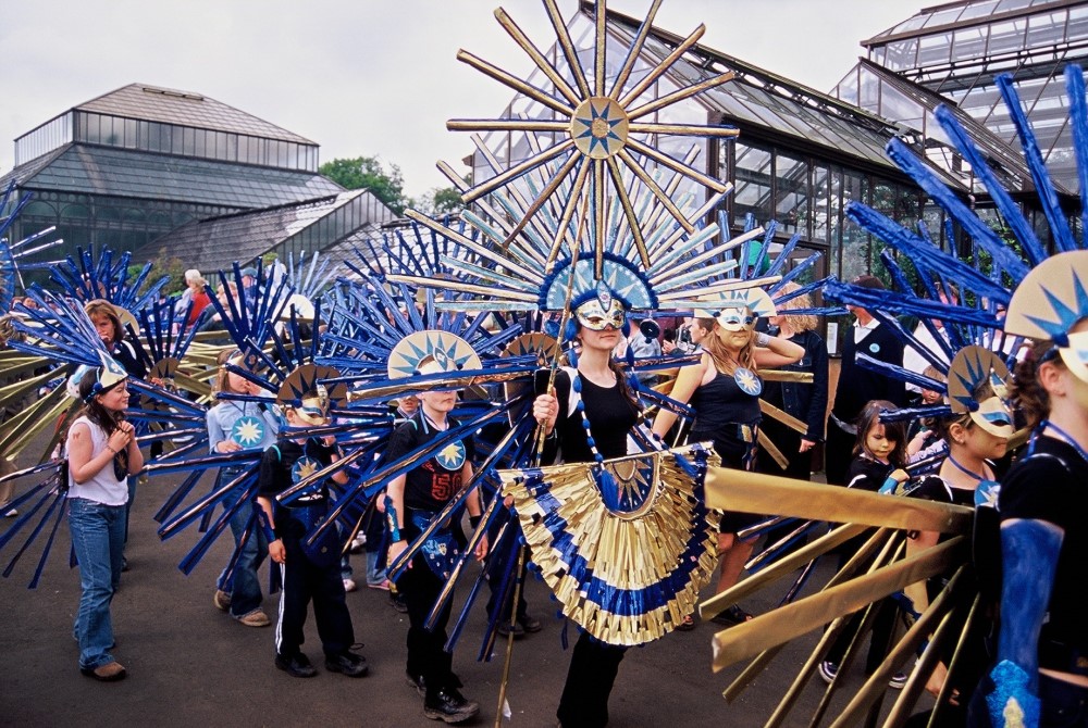 People in blue and gold carnival costumes