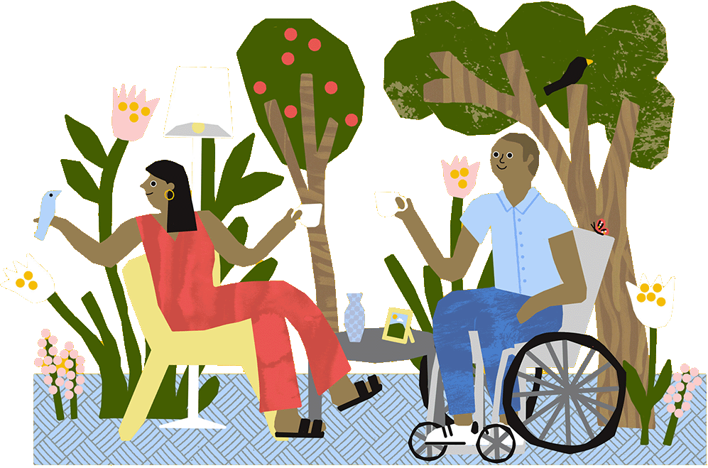a woman and a man in a wheel char sat down in their garden drinking tea.